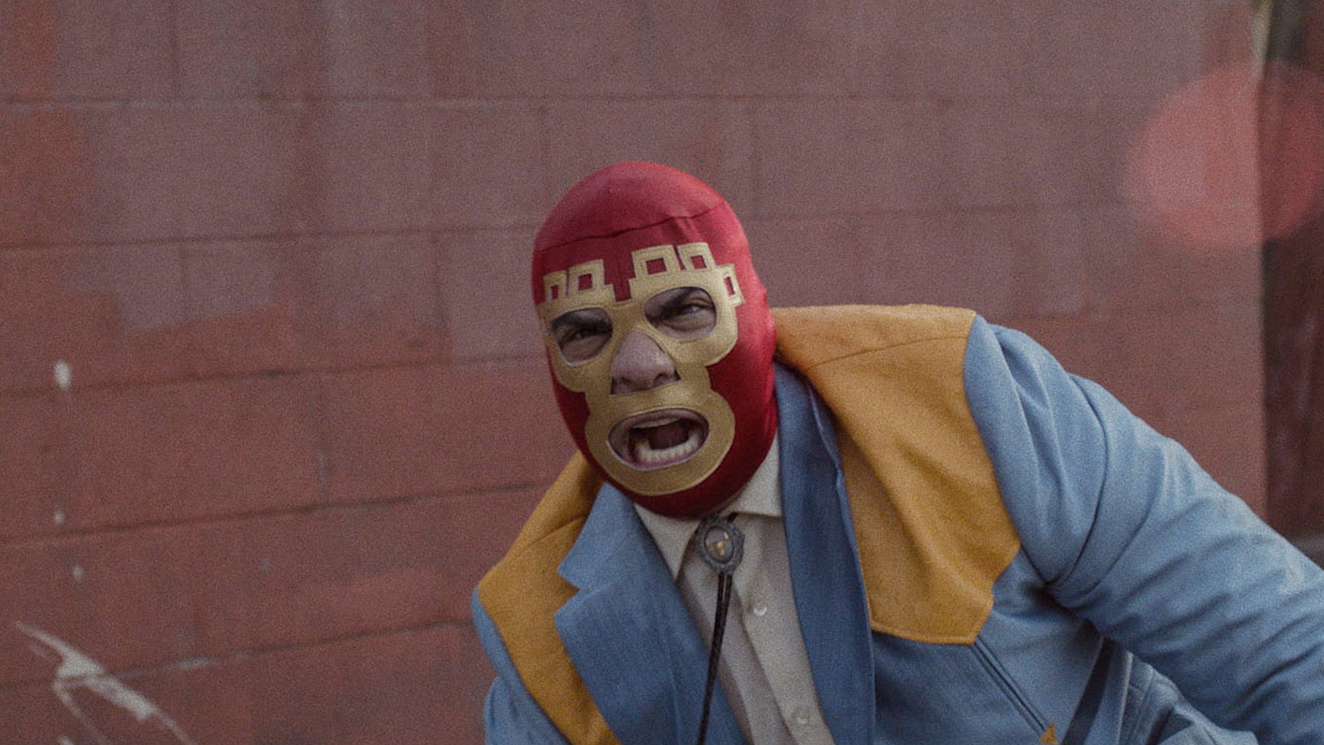 Trailer still frame from Lowlife, man in wrestling mask