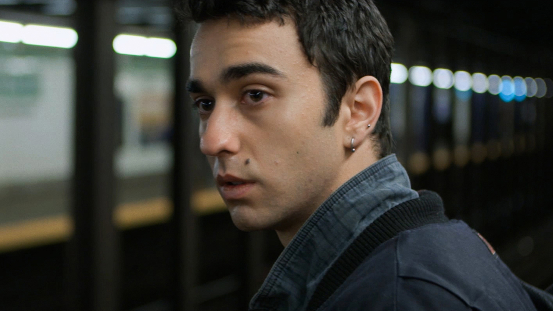 Trailer still frame from The Cat and the Moon, man at subway station