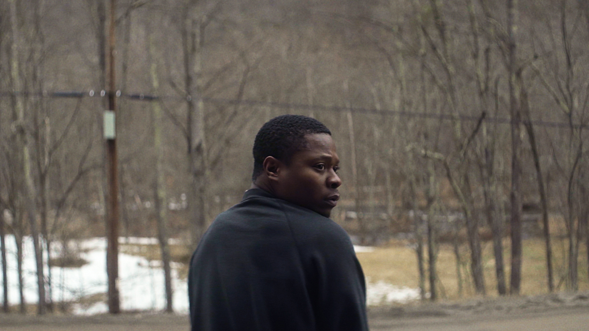 Trailer still frame from Tyrel, man on road