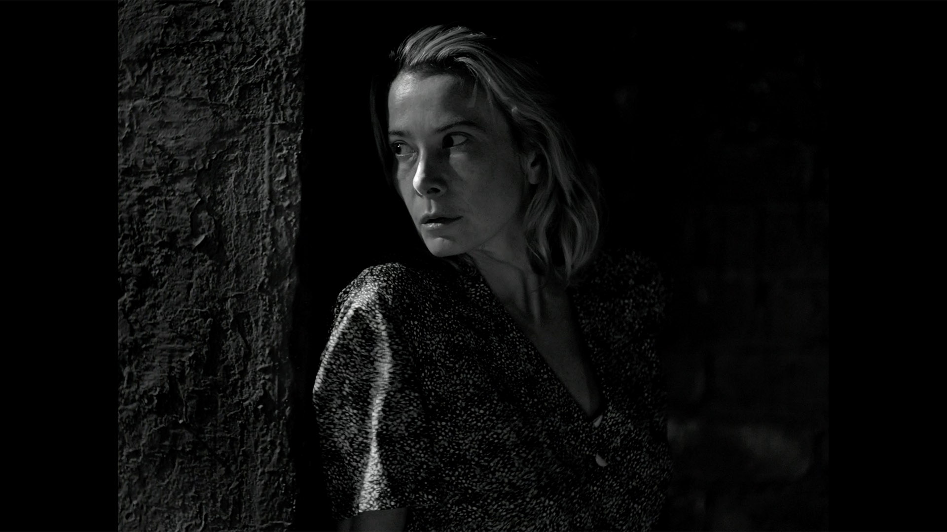 Trailer still frame from Dear Comrades, woman black and white