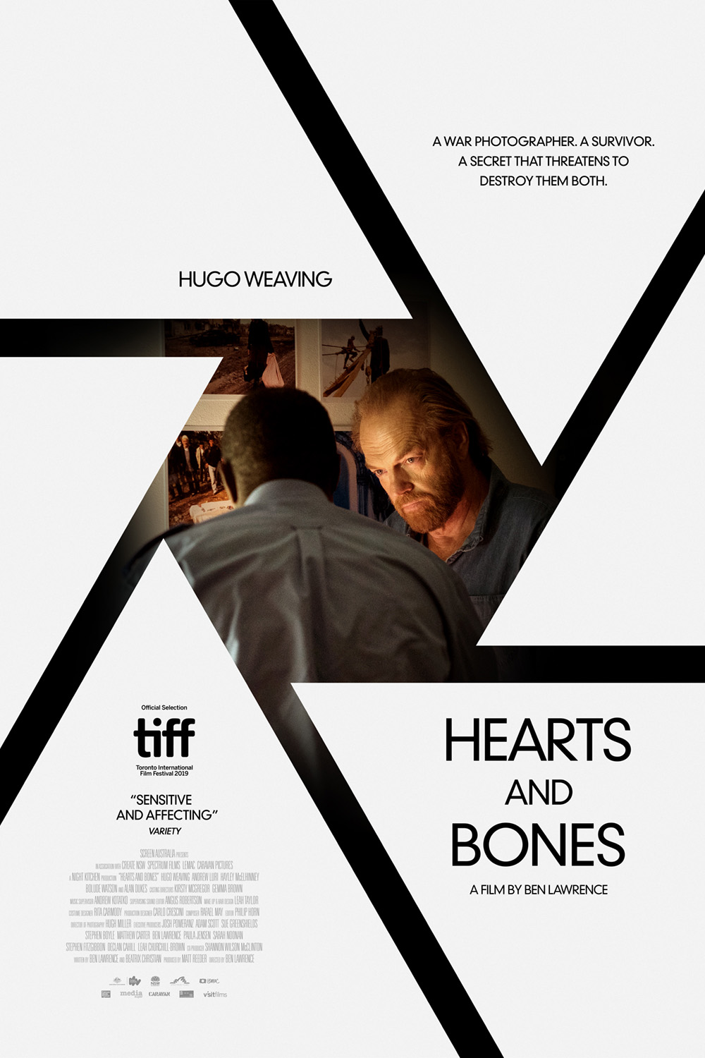 Movie poster for Hearts and Bones, two men in camera lens shutter