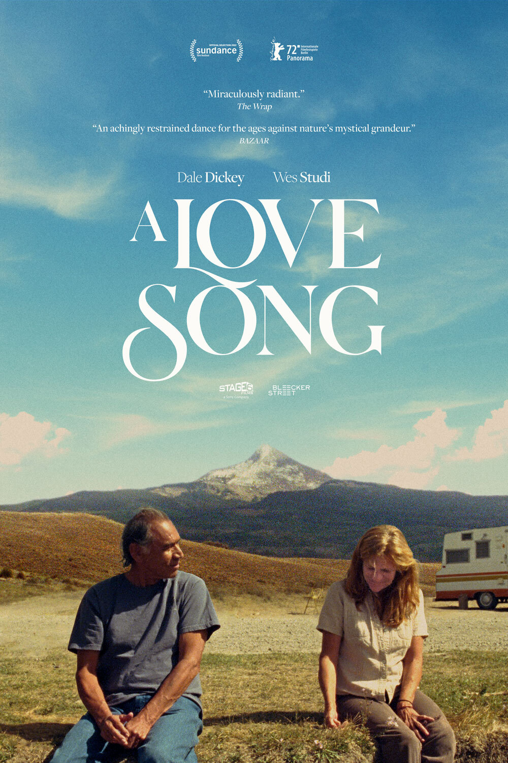 Movie poster for A Love Song, man adn woman sitting in field in front of mountain