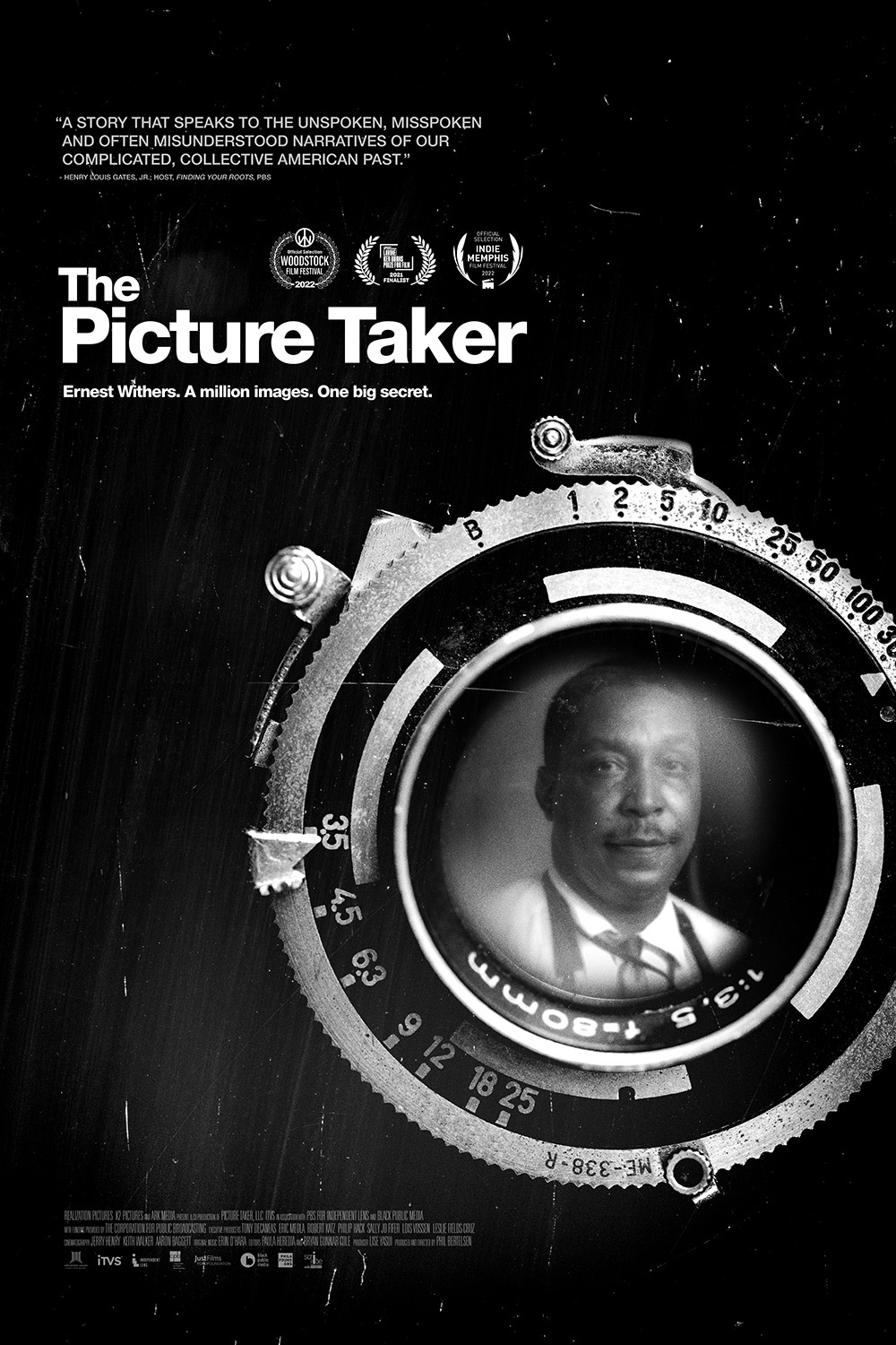 Movie poster for The Picture Taker, black and white picture of man in camera lens