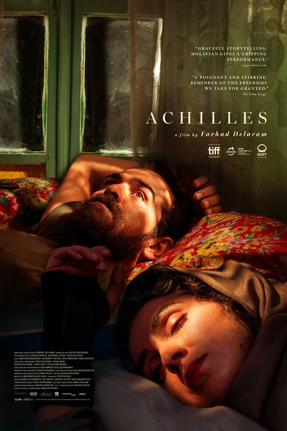 Movie poster for Achilles, man laying awake next to woman sleeping